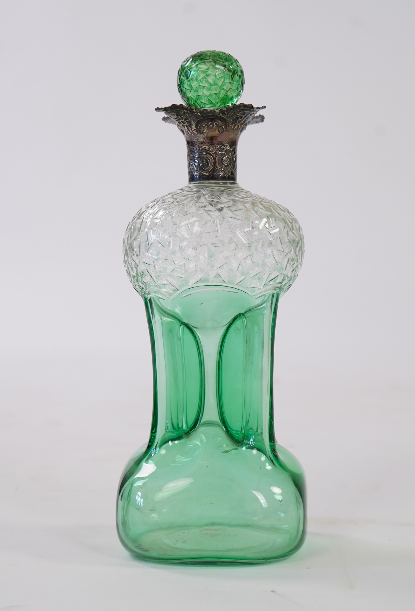 Attributed to Stevens and Williams of Stourbridge, a green flashed and cut pinched glass decanter